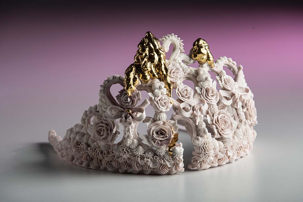 Crown Sculpture by Ebony Russell. "Piped Dreams - Pink Tiara (Nothing Breaks Like a Heart)", High Fired Piped Lumina Porcelain, Stain, Glaze and Gold lustre, 16cm x 24cm x 30cm